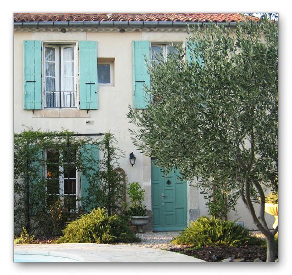 The south face of the house from the garden and pool.