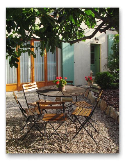 Cosy courtyard under the Fig tree, outside the master bedroom.